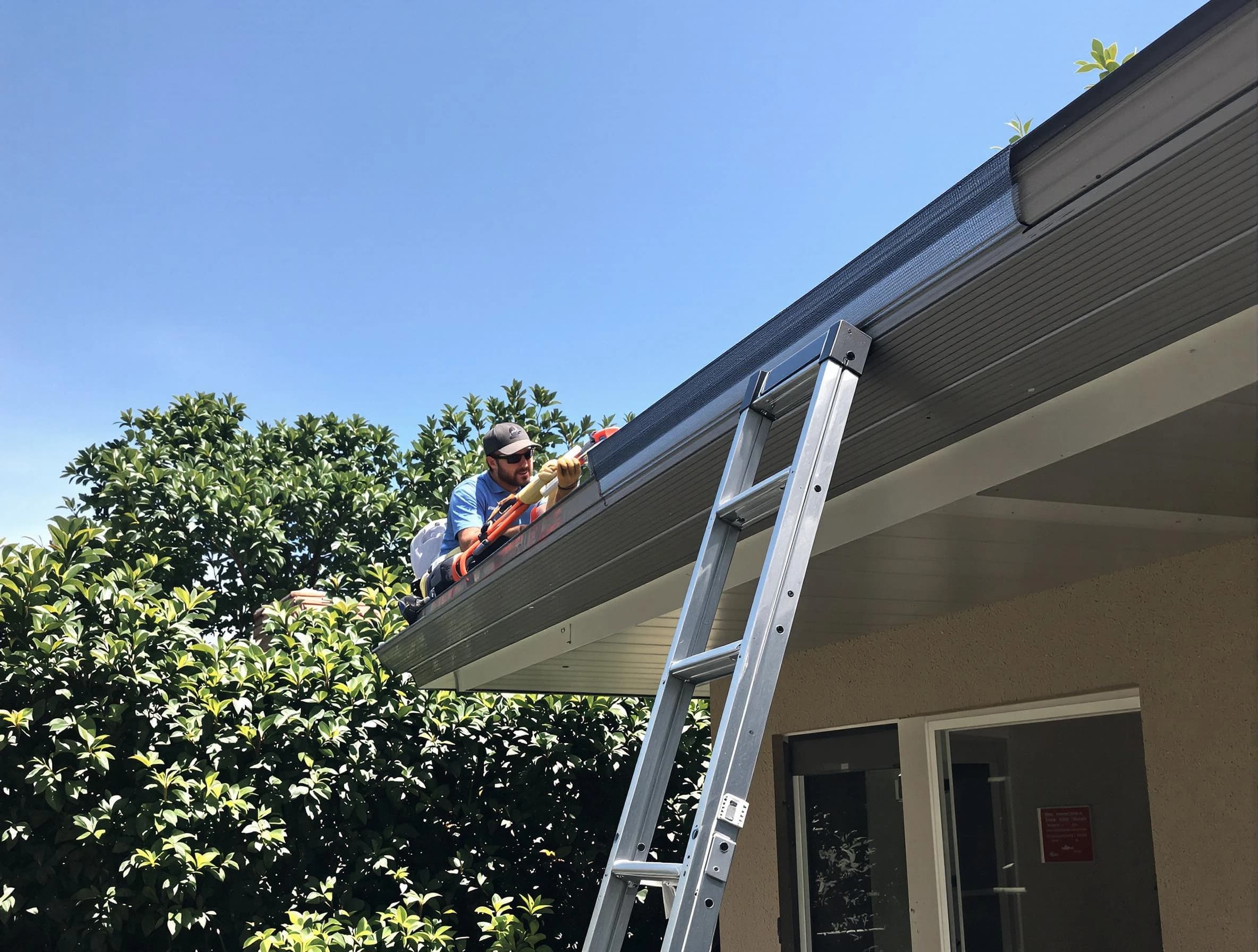 Eastlake Roofing Company installing gutter guards for a homeowner in Eastlake, OH